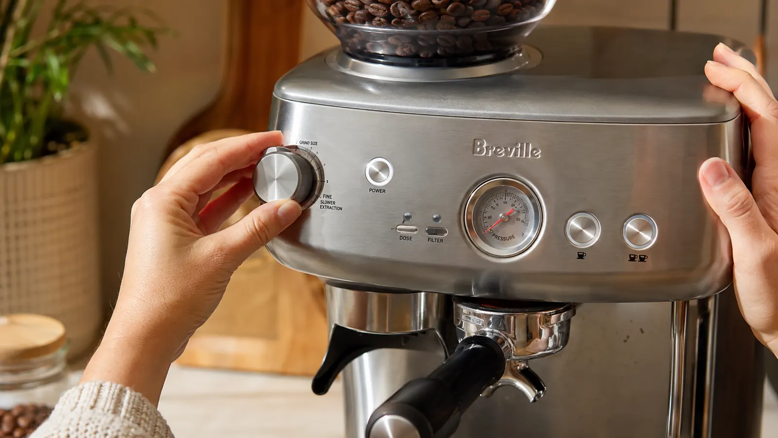 Close-up of the Breville Barista Express integrated grinder hopper and dose control dial